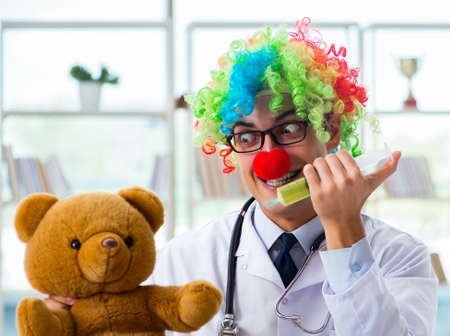 Funny pediatrician with toy in the hospital clinicの写真素材