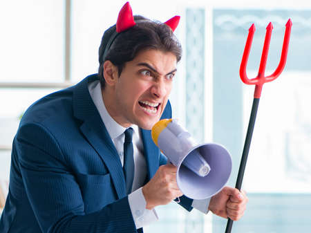 Devil angry businessman in the office