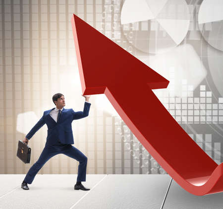 Businessman supporting growtn in economy on chart graph