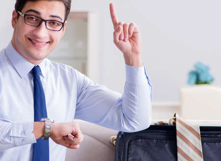 Businessman preparing packing for business tripの写真素材