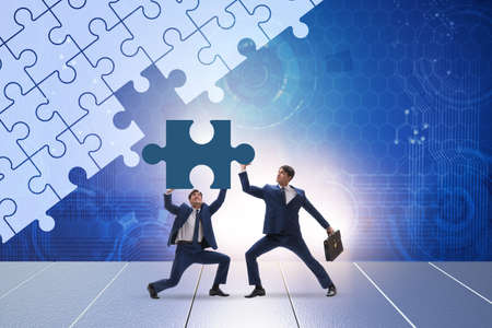 Concept of businessman with missing jigsaw puzzle pieceの写真素材