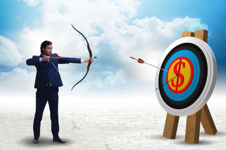 Businessman aiming arrow with bowの写真素材