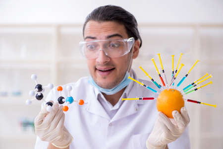Male nutrition expert testing food products in labの写真素材