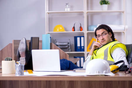 Young male architect working in the officeの写真素材