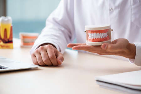 Male doctor stomatologist working in the clinicの写真素材