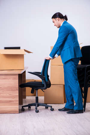 Young handsome businessman being fired from his workの写真素材