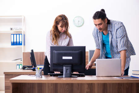 Young male it specialist in the officeの写真素材