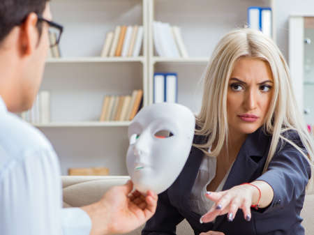 Young woman visiting psychiatrist man doctor for consultationの写真素材