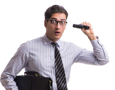 Young handsome businessman looking into future with binocularsの写真素材