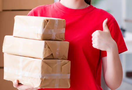 Young woman working in parcel distribution center