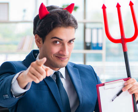 Devil angry businessman in the office