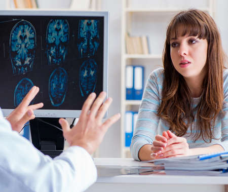 Young woman visiting radiologist for x-ray examの写真素材