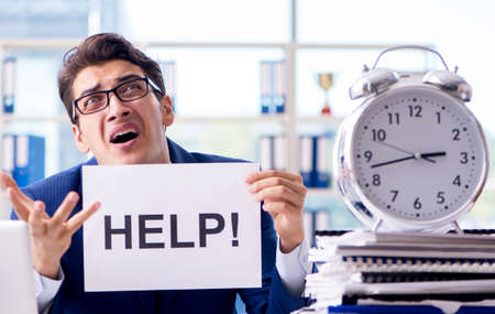 Businessman with message in the office at desk