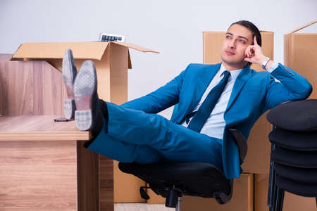 Young handsome businessman being fired from his workの写真素材