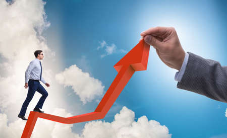 Businessman supporting growtn in economy on chart graphの写真素材