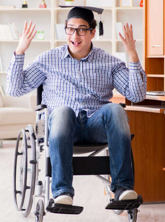 Disabled student studying at home on wheelchairの写真素材