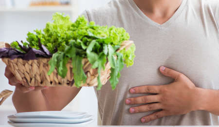 Young man in healthy eating and dieting conceptの写真素材