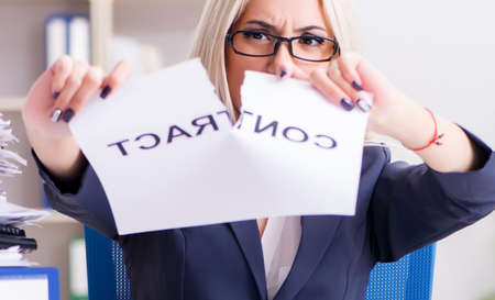 Businesswoman with message in office at desk