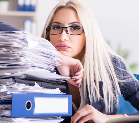 Busy businesswoman working in office at desk