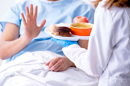 The male patient refuse to eat hospital foodの写真素材