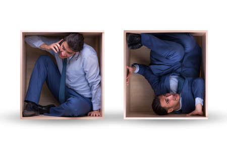 Employee working in tight spaceの写真素材