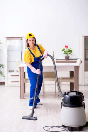 Old female contractor doing houseworkの写真素材