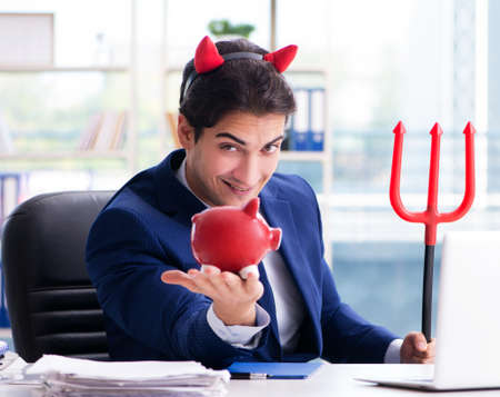 Devil angry businessman in the officeの写真素材