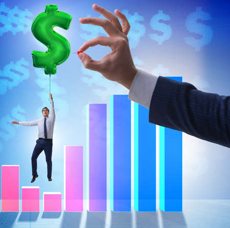 Businessman flying on dollar sign inflatable balloon over financの写真素材