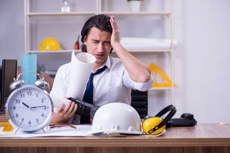 Young male architect working in the officeの写真素材