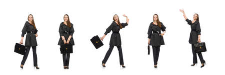 Cute girl in warm dark coat isolated on whiteの写真素材