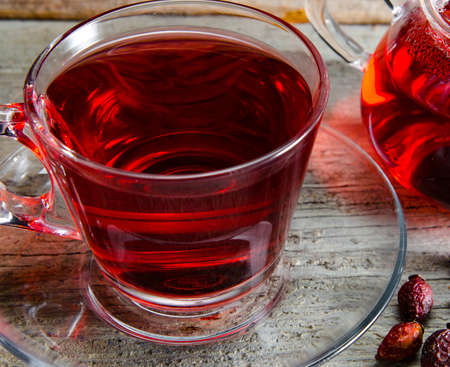 Fruit berry tea in the cup served on tableの写真素材