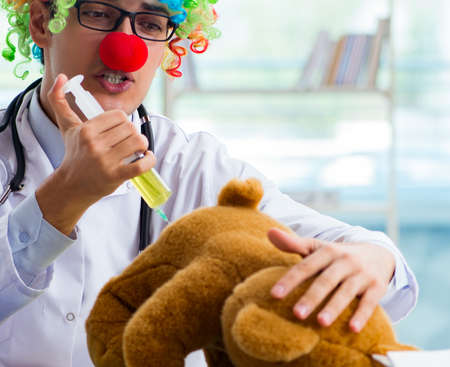 Funny pediatrician with toy in the hospital clinicの写真素材