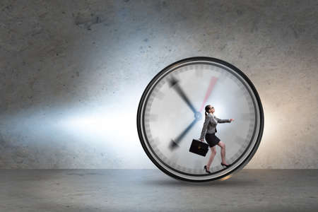Businesswoman employee in time management concept