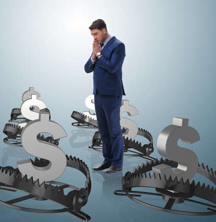 Businessman being trapped by dollarの写真素材
