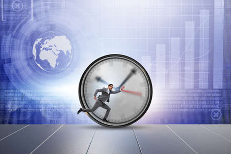 Businessman employee in time management conceptの写真素材