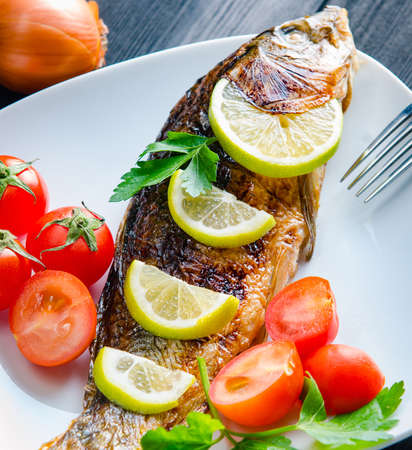 Fried fish served on the plate