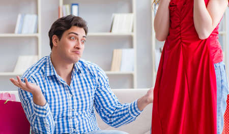 Young pair after shopping with many bagsの写真素材