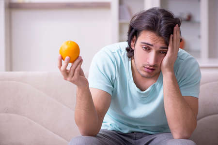 Young man suffering from allergyの写真素材