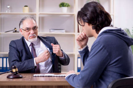 Old male lawyer in corruption conceptの写真素材