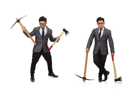 Young businessman holding a tool isolated on whiteの写真素材