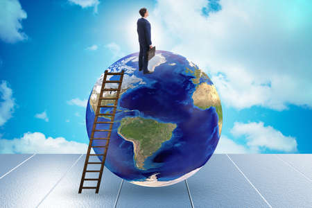 Businessman on top of the worldの写真素材