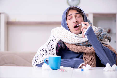 Young man suffering at home