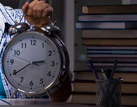 Student preparing for exams late night at homeの写真素材