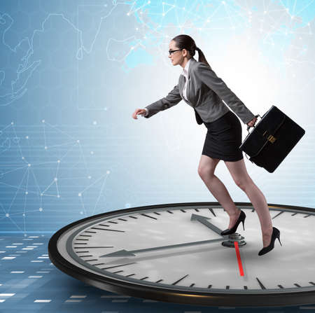 Businesswoman in time management conceptの写真素材