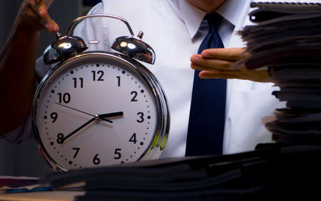 The young businessman working overtime late in office