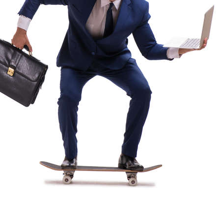 Businessman riding skateboard isolated on white backgroundの写真素材