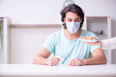 Young man suffering from allergyの写真素材