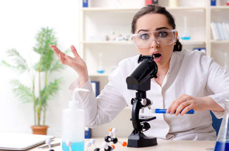 Young female chemist working in the labの写真素材