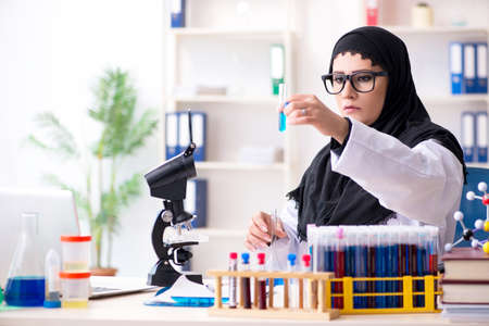 Female chemist in hijab working in the labの写真素材