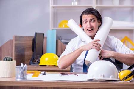 Young male architect working in the officeの写真素材